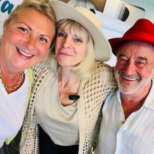 A photo of me, Marisa Peel, and John Davy, stood with arms around one another during the Founding Session of Peer Fertility Coaching in Los Angeles, June 2025